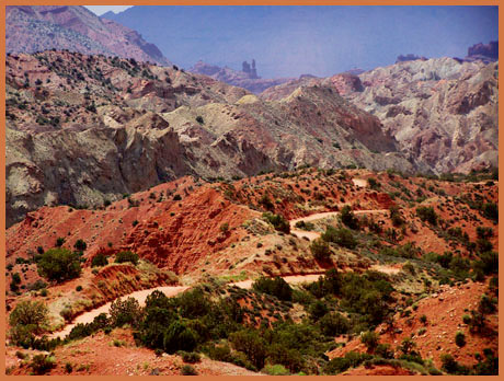Fisher Towers in background, while
descending Onion Creek Road from a ride on the
Kokopelli Trail